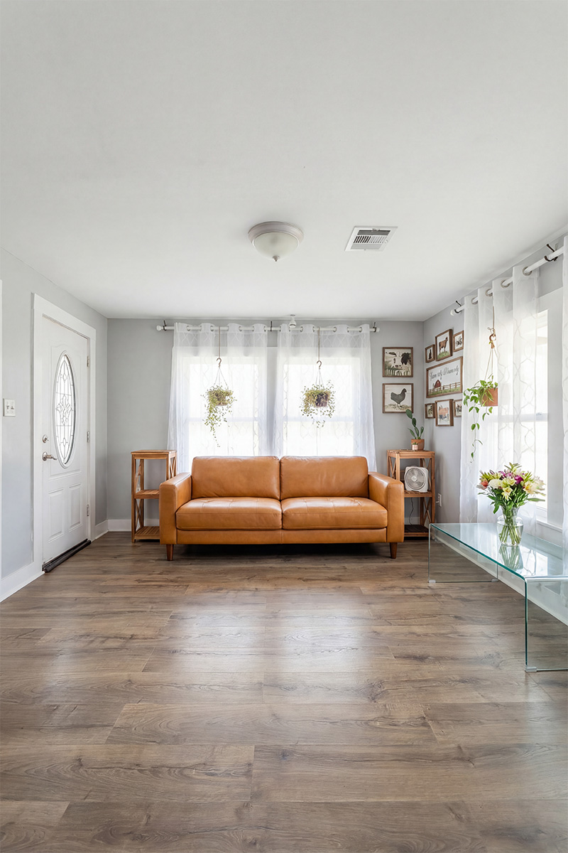 Living room after furniture replacement, fireplace and TV enhancement