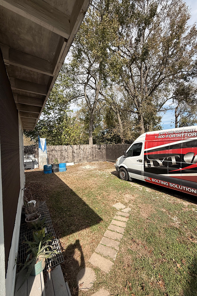Backyard with distracting items before cleanup and water enhancement