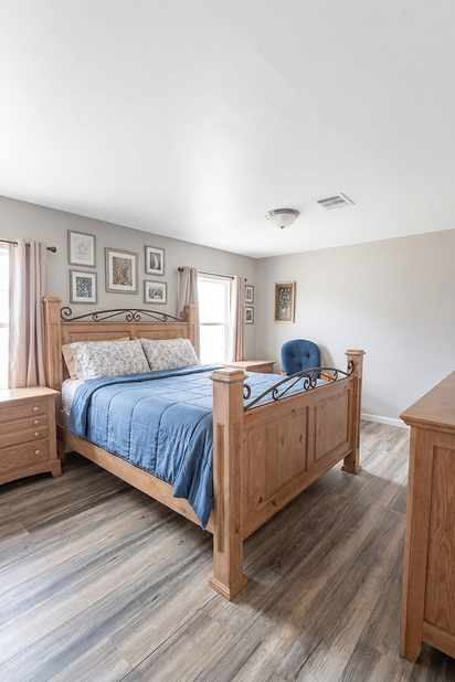 Bedroom fully staged, illustrating volume and layout